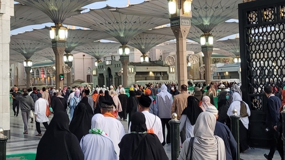 Muslims entering the Holy Mosque in Medina