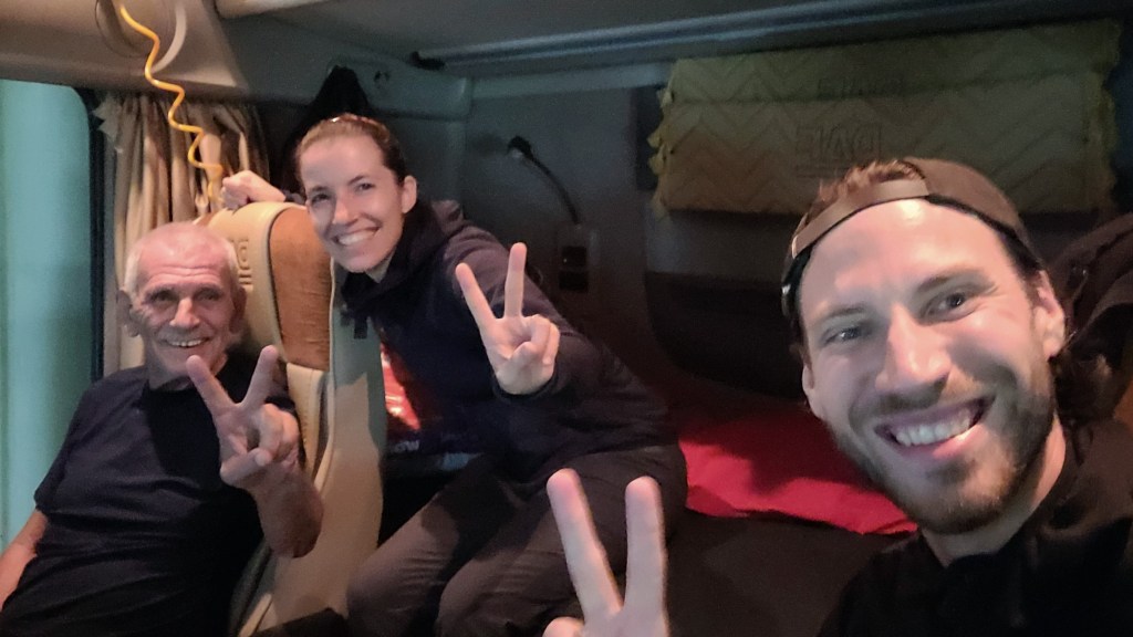 On the Caspian Sea Ferry with our new trucker friend showing us his truck